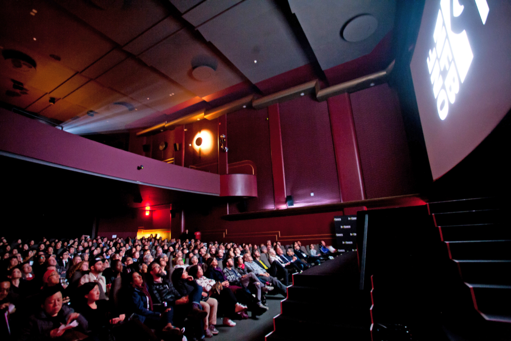 Film Enthusiasts watching a Documentary at HotDocs - festivals and events in Toronto this April